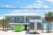 Modern coastal piling home in Navarre by Acorn Fine Homes