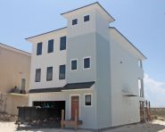 Davis modern coastal piling home on Navarre Beach by Acorn Fine Homes - Thumb Pic 2