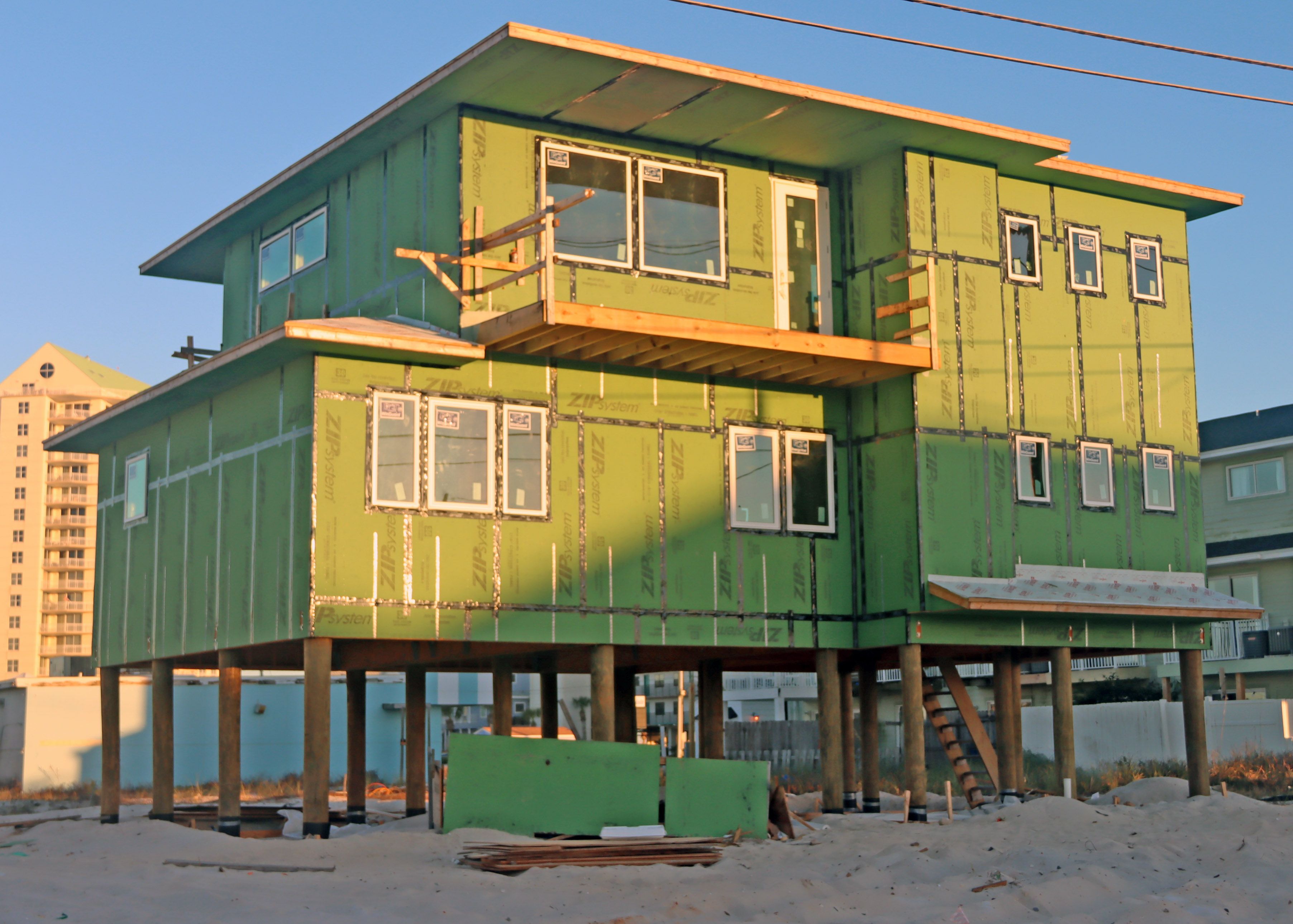 Modern coastal piling vacation rental home in Navarre by Acorn Fine Homes