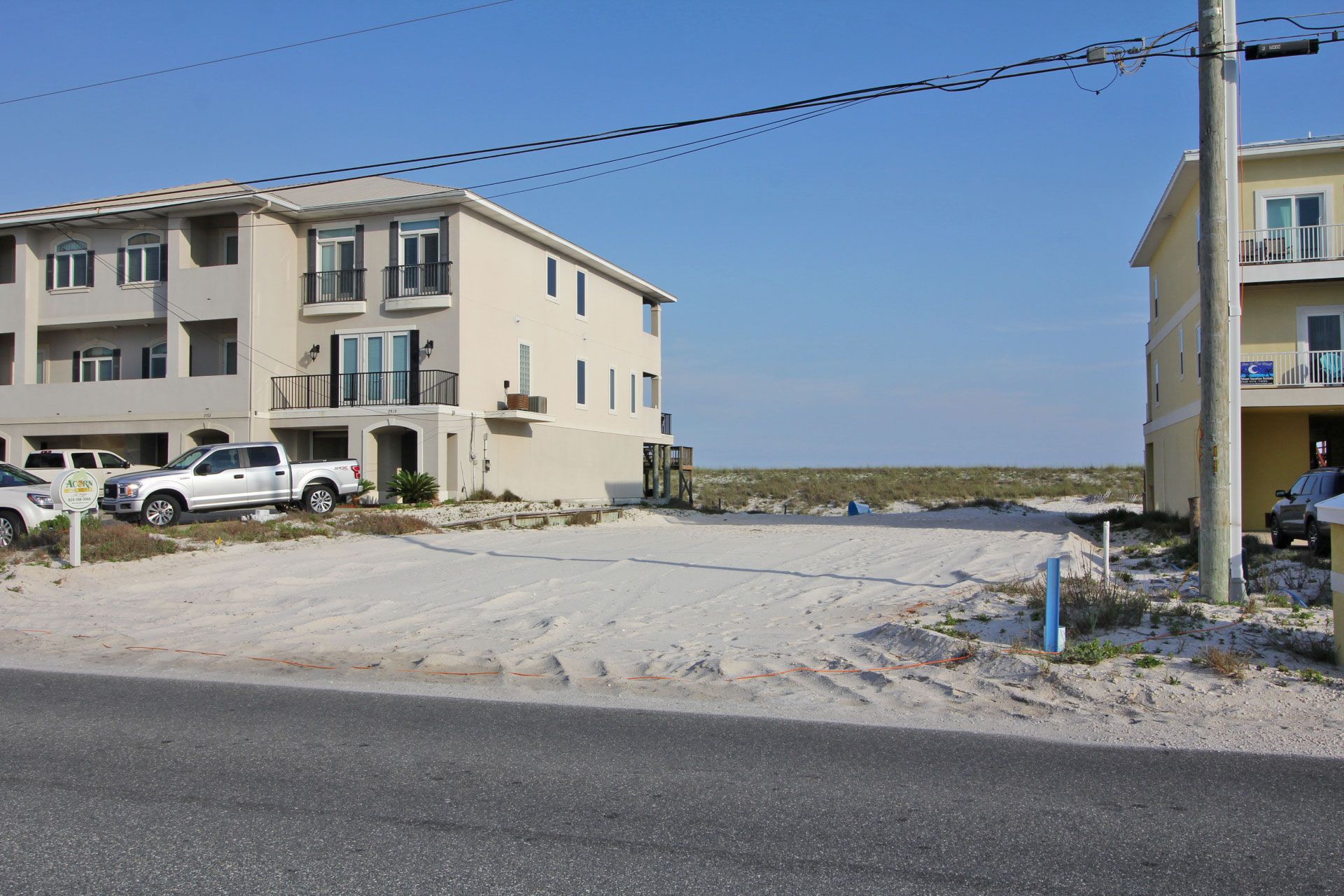 Davis modern coastal piling home on Navarre Beach by Acorn Fine Homes