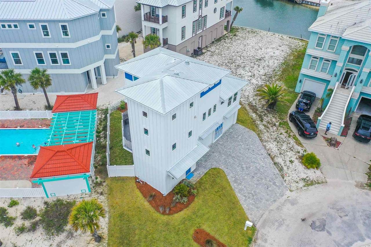 Slone modern coastal piling home on Navarre Beach by Acorn Fine Homes