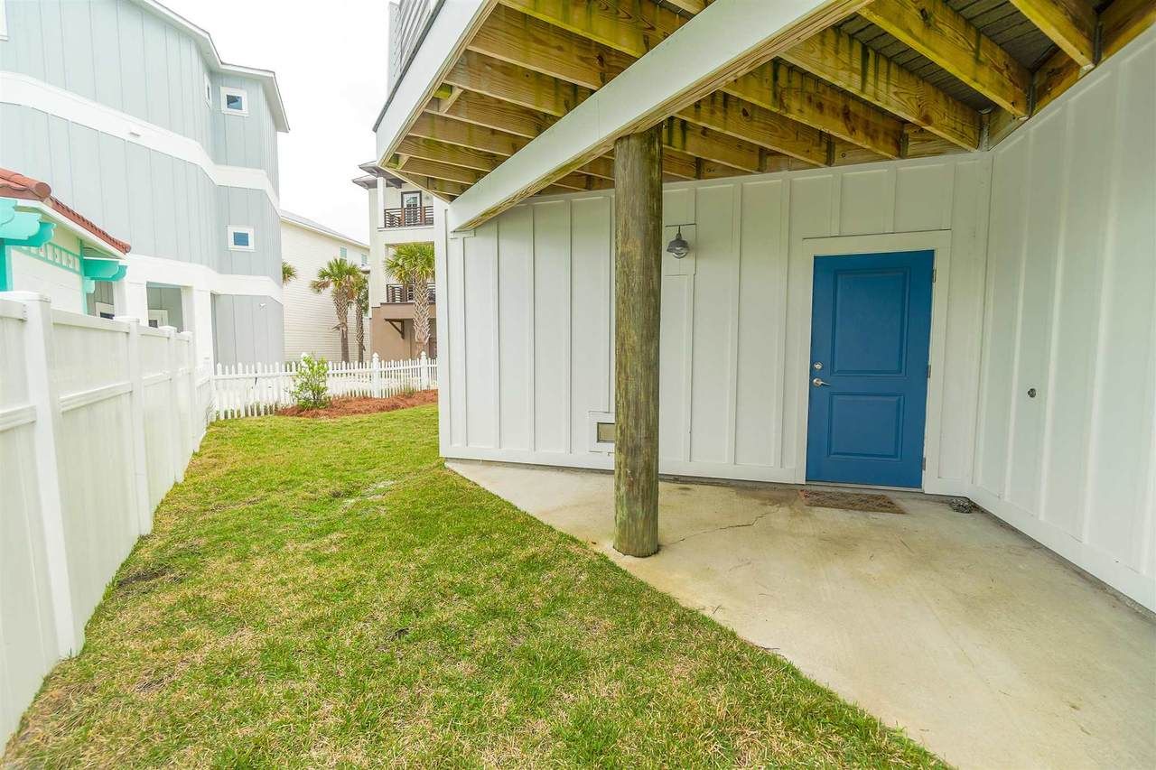 Slone modern coastal piling home on Navarre Beach by Acorn Fine Homes