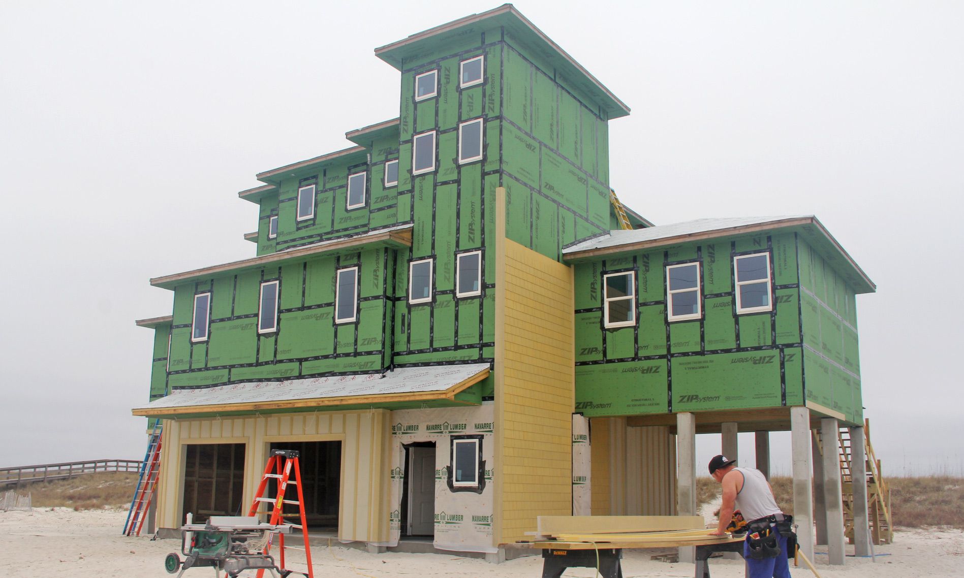 Burchard modern coastal style piling home on Navarre by Acorn Fine Homes