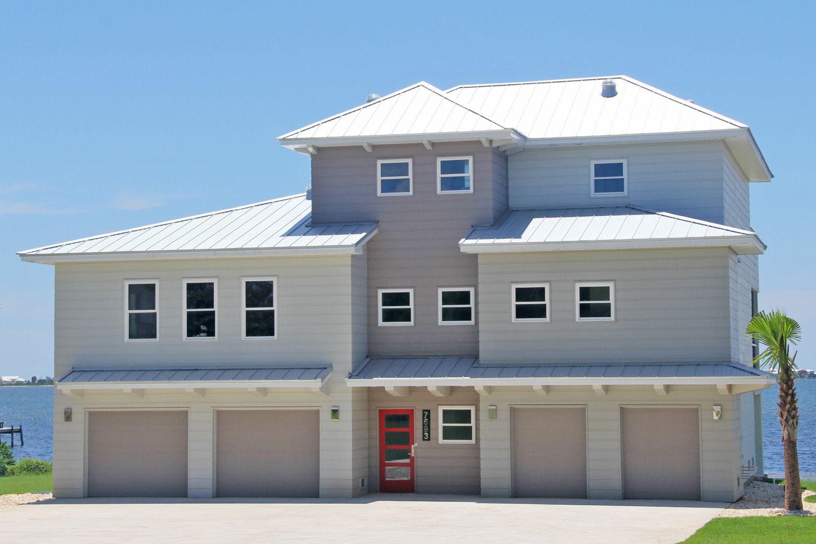 Modern piling home in Navarre by Acorn Fine Homes