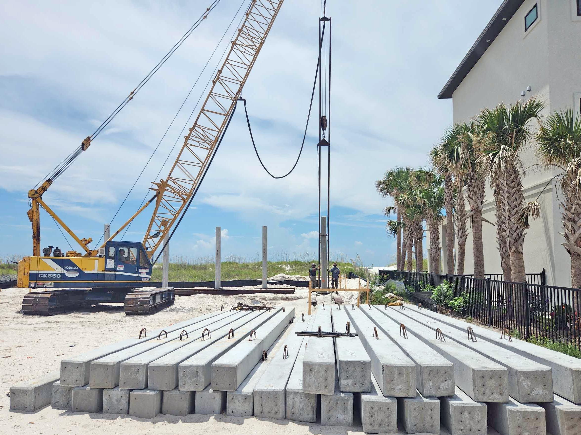 Modern coastal piling home on Navarre Beach by Acorn Fine Homes